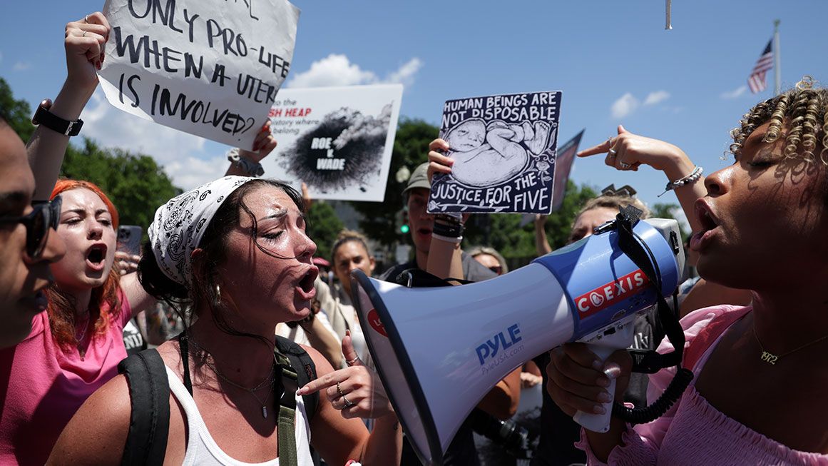 Pro-life and pro-choice protesters yelling at a protest | Alex Wong/Getty