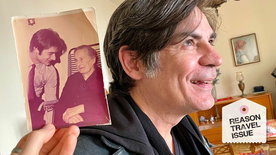 Nick Gillespie photographed alongside a photo of his ancestor | Photo: Sarah Rose Siskind