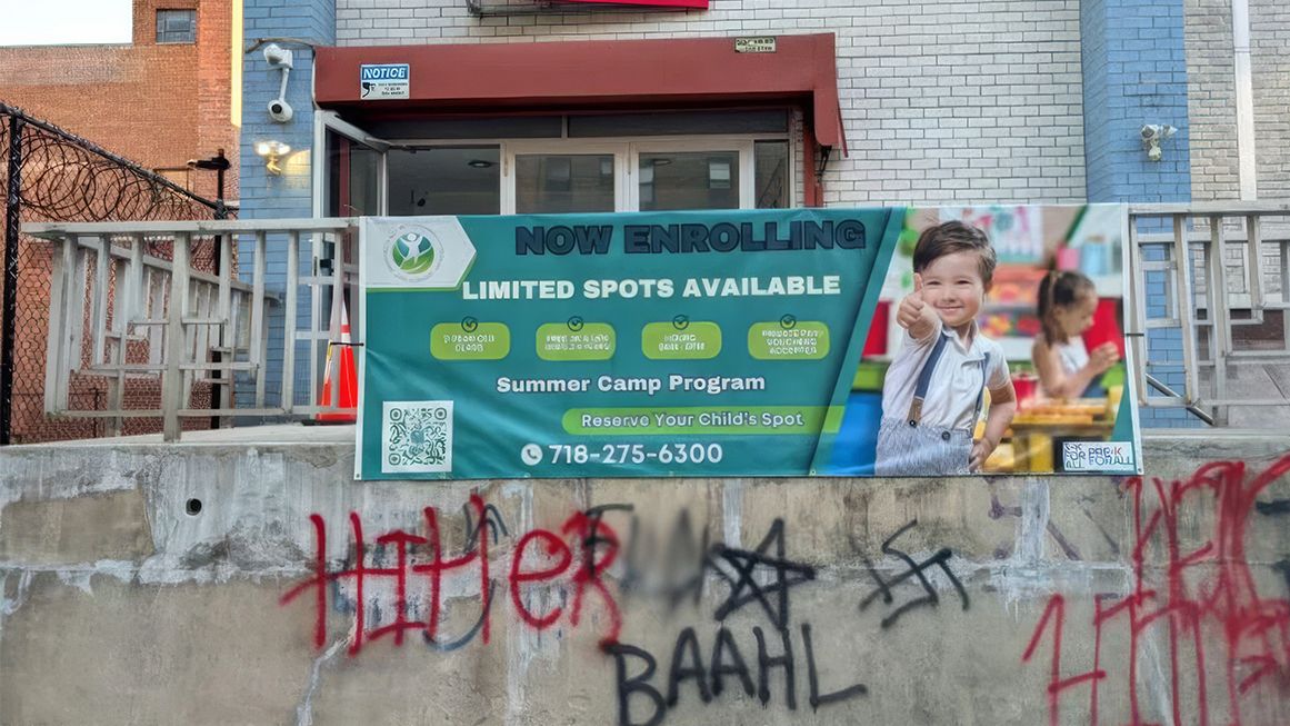 A concrete platform with graffiti, including a swastika | Photo: Graffiti on the Rego Park Jewish Center in Queens, New York; Rep. Grace Meng (D–N.Y.)/X