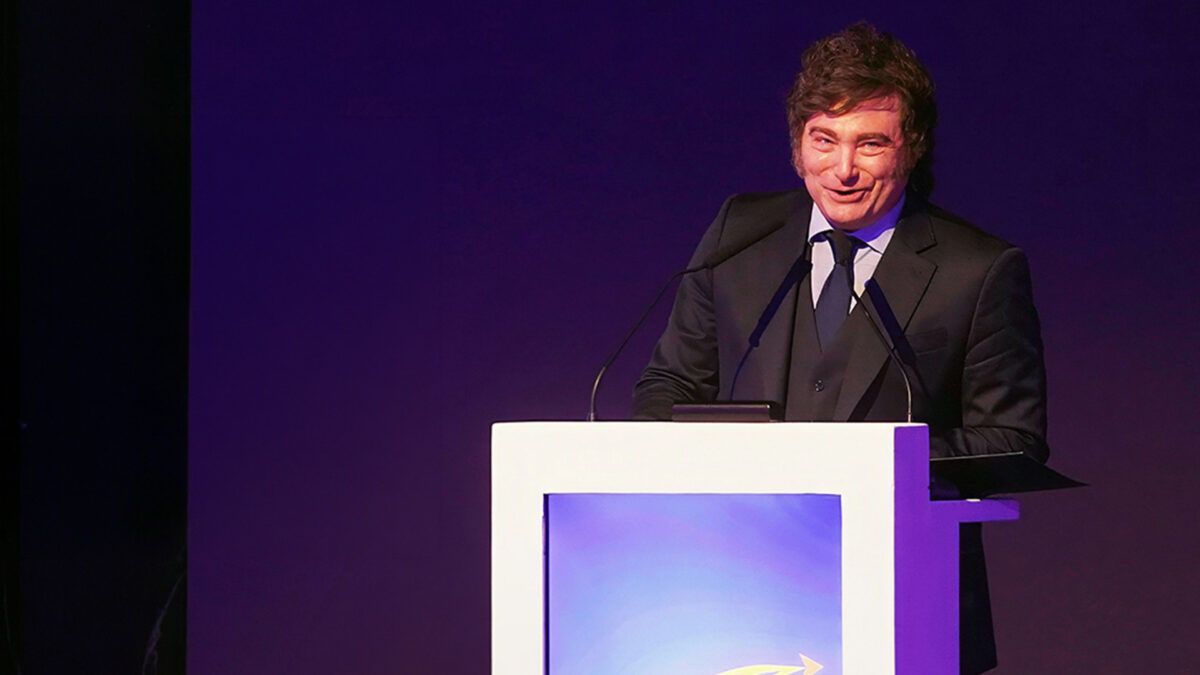 Javier Milei standing at a lectern | Photo: Melissa Mann