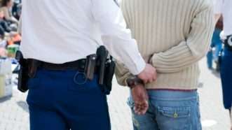 While that sweater is indeed a crime, it nevertheless shouldn't warrant an arrest. | Buurserstraat386 / Dreamstime.com