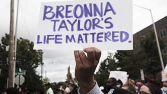 Breonna-Taylor-sign-Newscom | John Arthur Brown/Zuma Press/Newscom