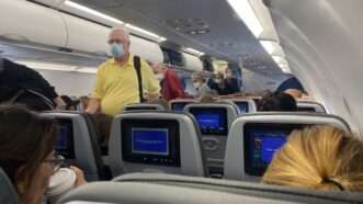 masked-airline-passengers-4-13-22-Newscom | Lindsey Nicholson/UCG/Universal Images Group/Newscom