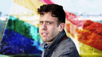 Author James Kirchik in front of a rainbow flag | Lex Villena, Reason