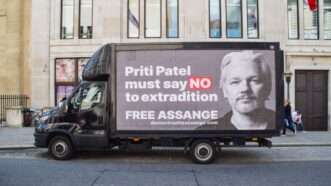 Truck with ad opposing Assange's extradition | Vuk Valcic/ZUMAPRESS/Newscom