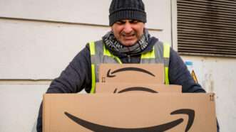 An Amazon delivery driver struggles to deliver packages.