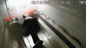 Image of Randy Cox lying on the floor of a police van. | New Haven Police Department