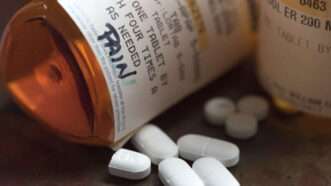 Bottle of pain pills tipped over. | Robin Rayne/ZUMAPRESS/Newscom