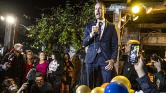 Chesa Boudin holding microphone giving speech to group of supporters. | TERRY SCHMITT/UPI/Newscom