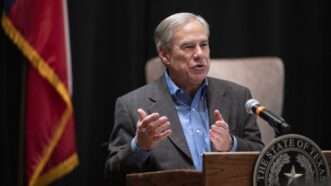 Texas Governor Greg Abbott speaks next to the American flag | Bob Daemmrich/ZUMAPRESS/Newscom
