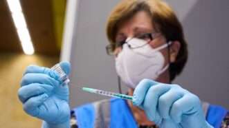 Woman preparing monkeypox vaccine injection