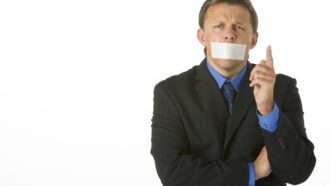 Man with mouth taped | Monkey Business Images / Dreamstime.com