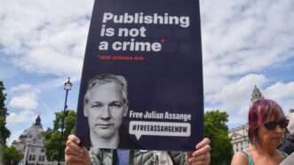 Assange protest poster | Vuk Valcic/ZUMAPRESS/Newscom