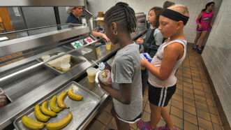 Students in school cafeteria line | Douglas Graham / Loudoun Now/Newscom