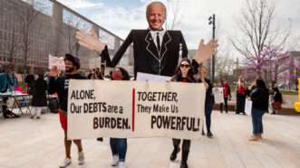 student debt protest signs | Allison Bailey/ZUMAPRESS/Newscom