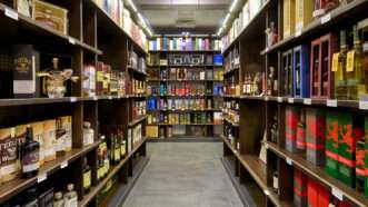 A grocery store aisle of wine bottles | Photo 164801995 © Scaliger | Dreamstime.com