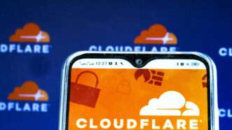 Cloudflare app on phone against a Cloudflare logo background