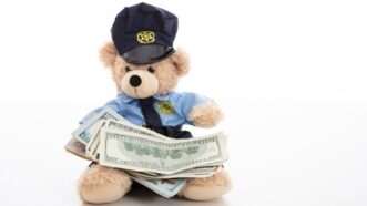 Police teddy bear with cash