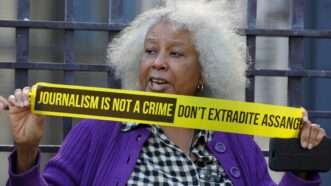 Person protesting Assange extradition | Steve Taylor / SOPA Images/Sipa/Newscom