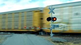 A train passes through a railroad crossing