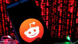 Reddit logo against red background | Avishek Das/ZUMAPRESS/Newscom