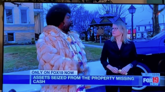 view of TV broadcast featuring Afroman talking to a reporter from fox 19 news | screenshot of Fox 19 broadcast via Afroman/Instagram
