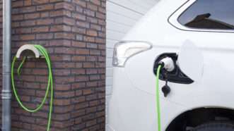 An electric car charging at home.
