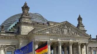 German and European Union flags in front of the Reichstag Building in Berlin. | imageBROKER/Uwe Kazmaier/Newscom