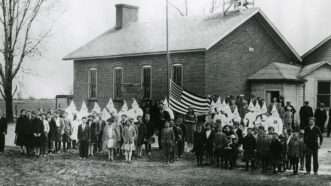 topicshistory | Photo: A group of schoolchildren at the Perry Center School in Wood County, Ohio, receiving a flag donated by the Ku Klux Klan; Center for Archival Collections/Bowling Green State University