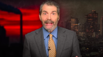 John Stossel is seen in front of a red sky and a city skyline