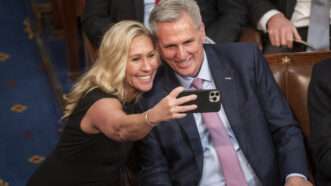 Marjorie Taylor Greene and Kevin McCarthy take a selfie together in Congress