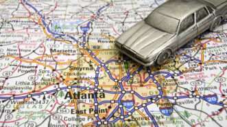 Car driving on a map of Atlanta | Photo 35164105 © Karen Foley | Dreamstime.com