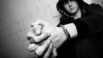 Teenager in handcuffs | Photo 4318261 © Alptraum | Dreamstime.com