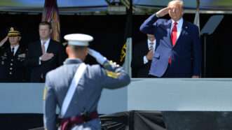 President Donald Trump salutes a cadet at the 2020 West Point graduation ceremony.