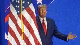 Trump next to USA flag
