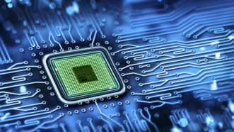 A microchip is seen on a motherboard | Photo 30451502 © Warenemy | Dreamstime.com