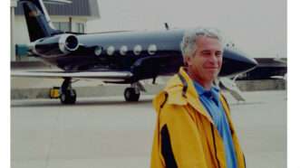 Epstein in front of a plane photo from government exhibit
