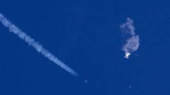 topicsphoto | Photo: An F-22 jet flies near the remnants of a suspected Chinese spy balloon; Chad Fish/Associated Press