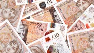 A scattered pile of U.K. pound sterling bank notes. | Webumzzz | Dreamstime.com