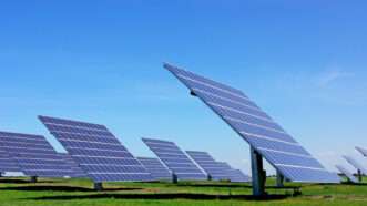 An array of photovoltaic solar panels in a field. | DPST/Newscom