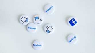 thumbs up and thumbs down buttons next to Facebook logo buttons