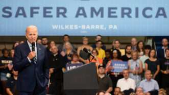 President Joe Biden addresses a crowd in Wilkes-Barre, Pennsylvania, beneath a giant banner reading "SAFER AMERICA" | Aimee Dilger/ZUMAPRESS/Newscom