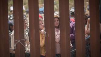 Women behind a border wall between Mexico and the US | Antonio Castaneda/dpa/picture-alliance/Newscom