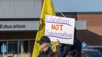 Protesters in St. Paul, Minnesota, hold a sign saying "Education NOT indoctrination." | Michael Siluk / Universal Images Group/Newscom