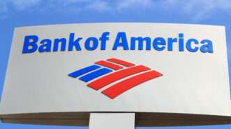 A Bank of America sign against a blue sky backdrop. | Luckydoor | Dreamstime.com