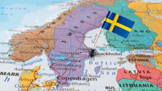 A map of Scandinavia with the Swedish flag pinned to it |  Sjankauskas/Dreamstime.com