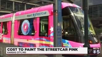 A screenshot from local TV news coverage of Kansas City's Barbie-themed streetcar | KCTV