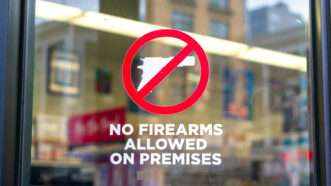 Sign on a business that reads "No Firearms Allowed on Premises." | Michael Vi | Dreamstime.com
