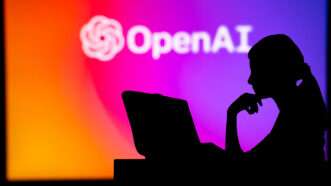 Open AI on a vibrant wall with a woman sitting at a desk in the shadow | Photo 269005523 | Artificial Intelligence © Peter Kováč | Dreamstime.com