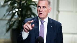 Kevin McCarthy standing in front of a microphone | Tom Williams/CQ Roll Call/Newscom